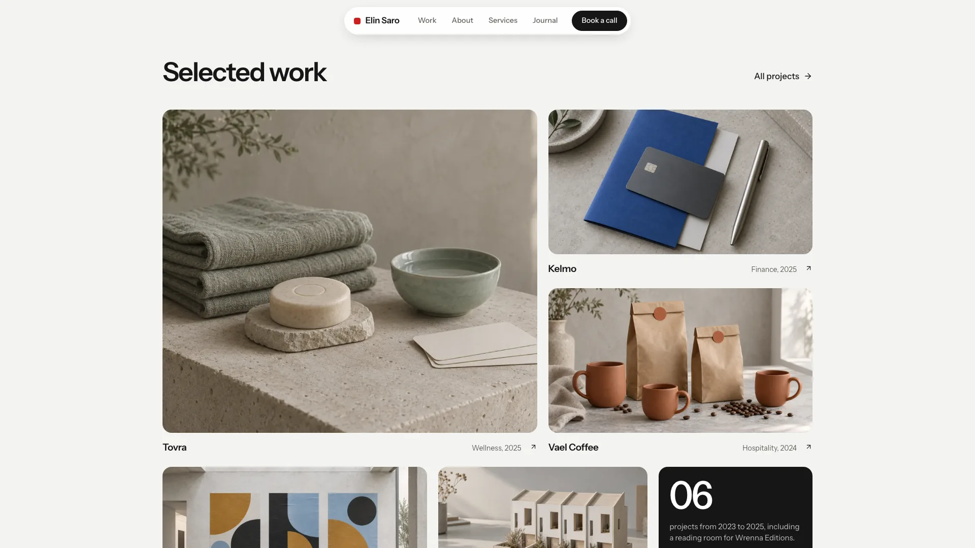 Selected work section with a large stone-and-towels still life for Tovra, a blue booklet and card for Kelmo, kraft coffee bags for Vael Coffee and a dark tile counting six projects