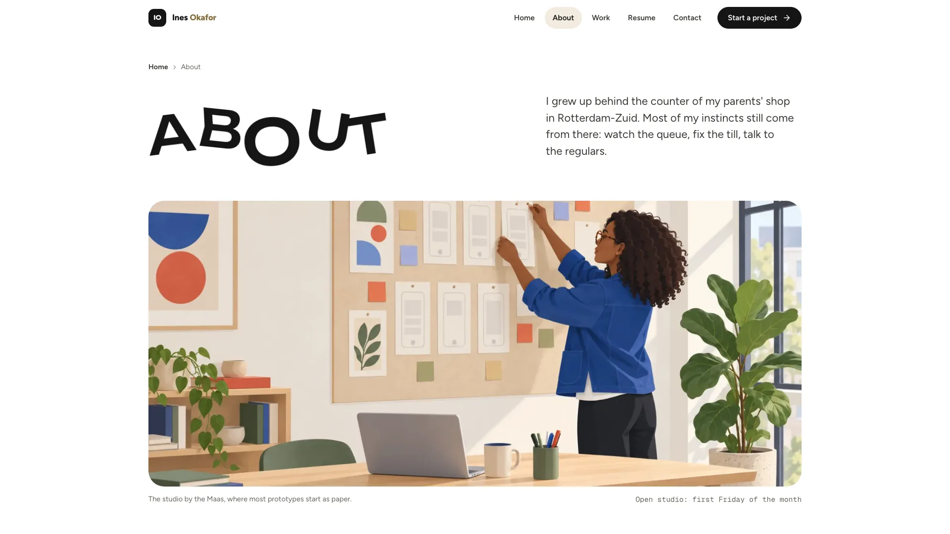 About page with the tilted word ABOUT and an illustration of the designer pinning paper prototypes in a sunny studio