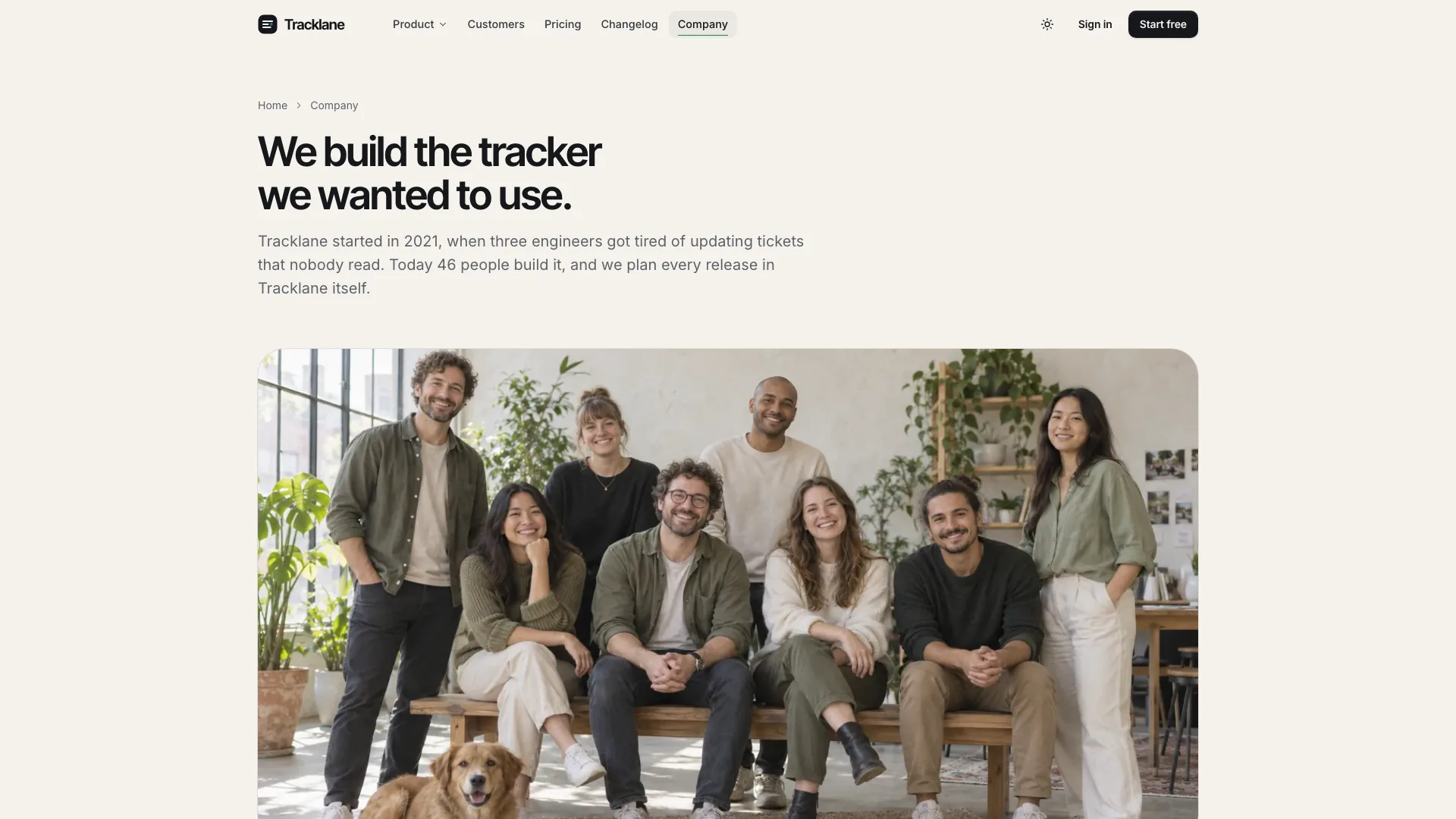 Company page titled We build the tracker we wanted to use with a short origin story and a team photo in a plant-filled studio
